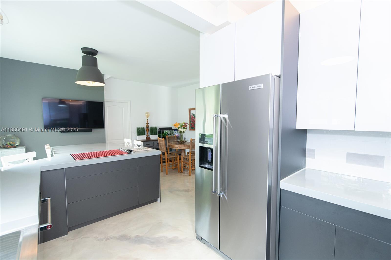 8694 Vía Reale, Unit 3 Boca Raton, FL 33496 - Photo 5 of 15 a kitchen with refrigerator and cabinets