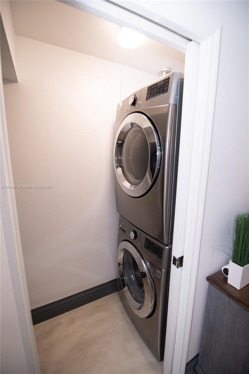 8694 Vía Reale, Unit 3 Boca Raton, FL 33496 - Photo 7 of 15 a utility room with dryer and washer