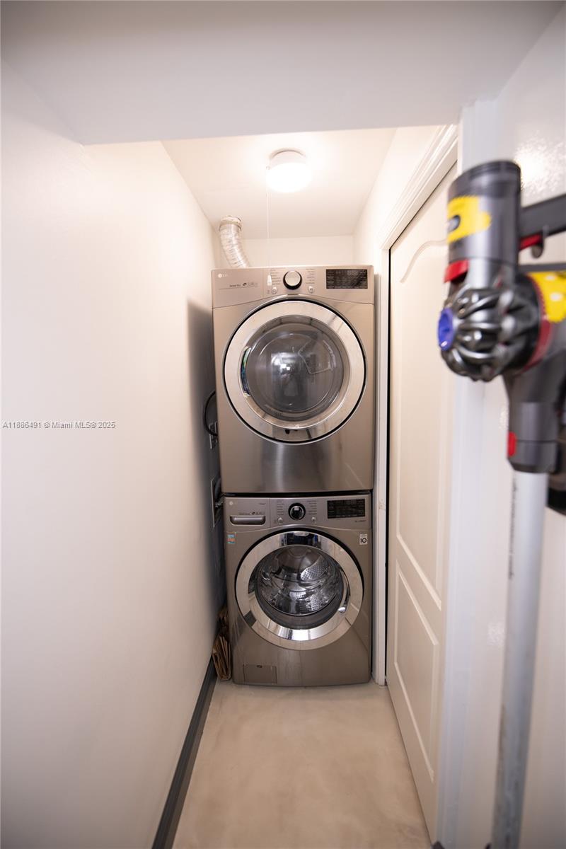 8694 Vía Reale, Unit 3 Boca Raton, FL 33496 - Photo 8 of 15 a utility room with dryer and washer