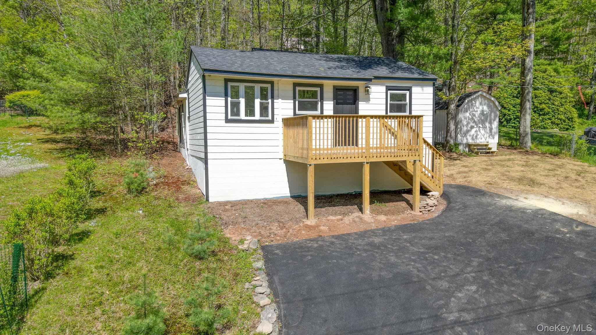 25 Overlook Road Woodbourne, NY 12788 - Photo 3 of 22 a view of a house with backyard porch and sitting area