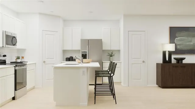 a kitchen with a stove and a refrigerator