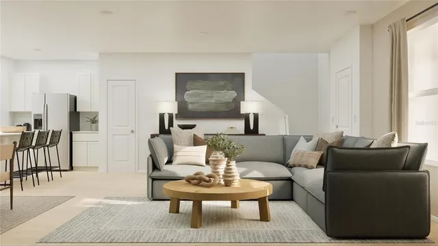 a living room with furniture and a table
