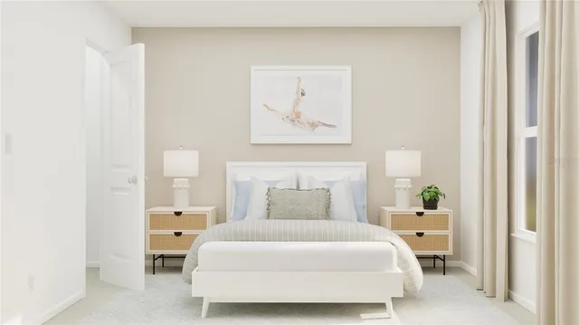 a bedroom with a bed and painting on the wall