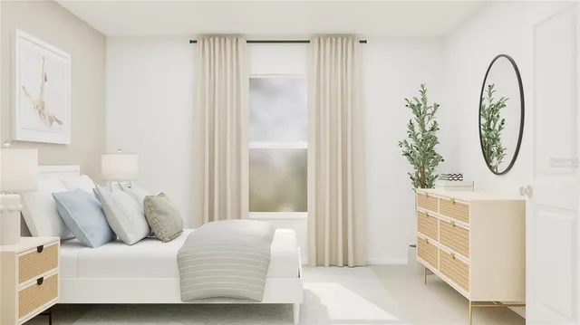 a bedroom with a bed and a potted plant