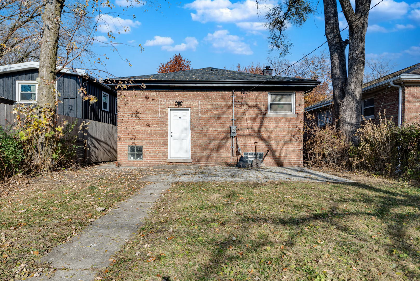 1319 East 89th Street Chicago, IL 60619 - Photo 17 of 17 a view of a house with a snow in the yard