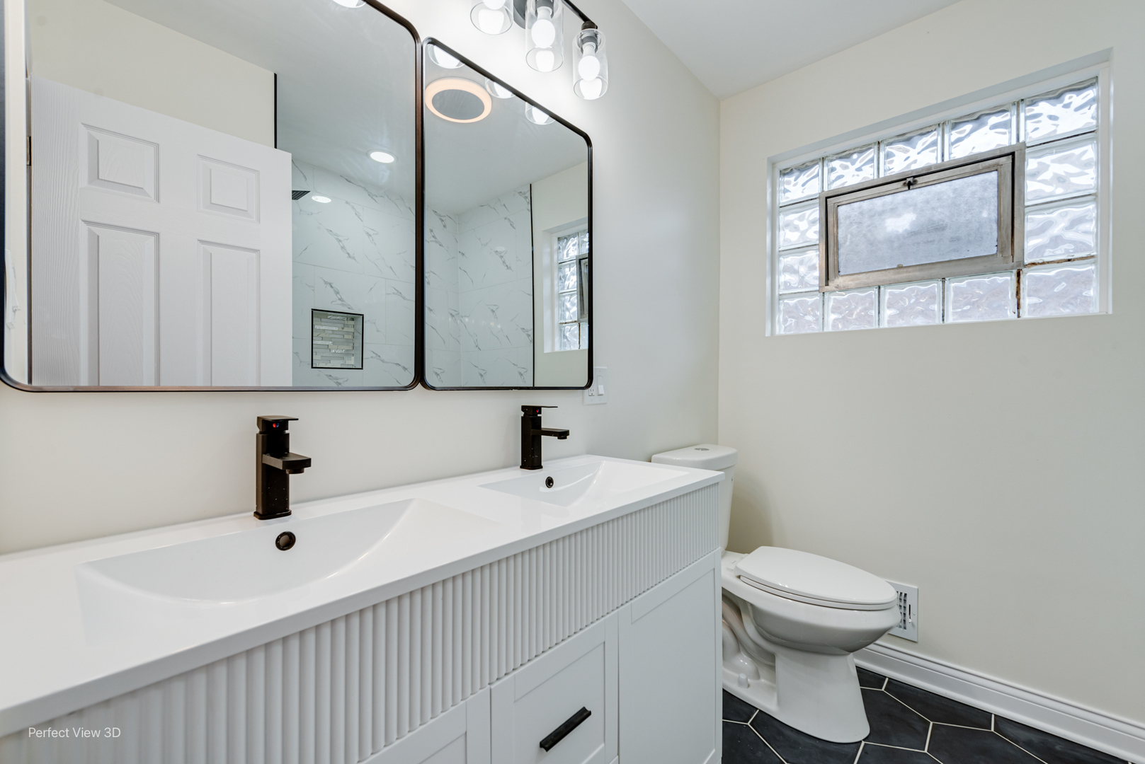 1319 East 89th Street Chicago, IL 60619 - Photo 4 of 17 a bathroom with a sink a toilet and mirror