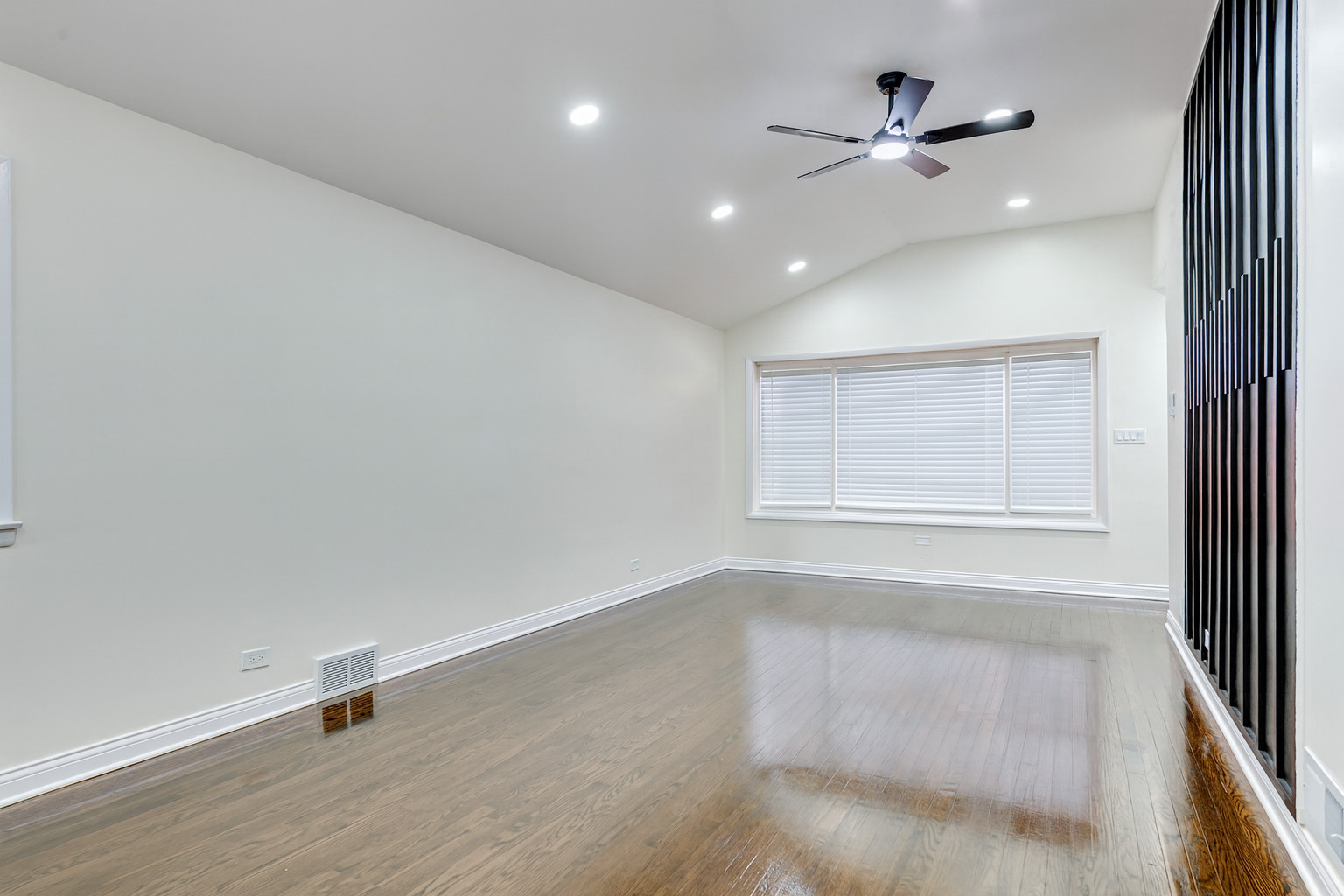 1319 East 89th Street Chicago, IL 60619 - Photo 6 of 17 wooden floor in an empty room with a window