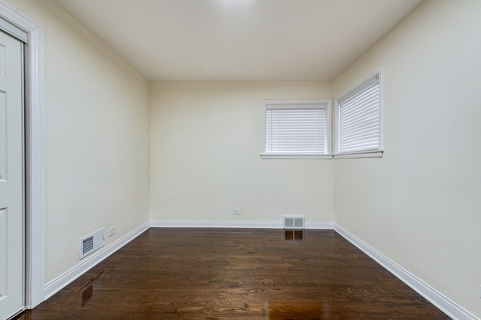 1319 East 89th Street Chicago, IL 60619 - Photo 9 of 17 a view of a room with wooden floor and window