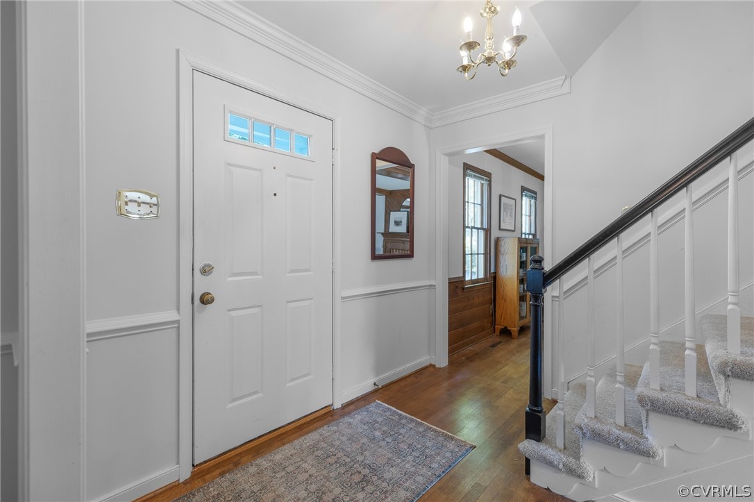 850 Watch Hill Road Midlothian, VA 23114 - Photo 7 of 32 a view of a hallway with wooden floor and staircase