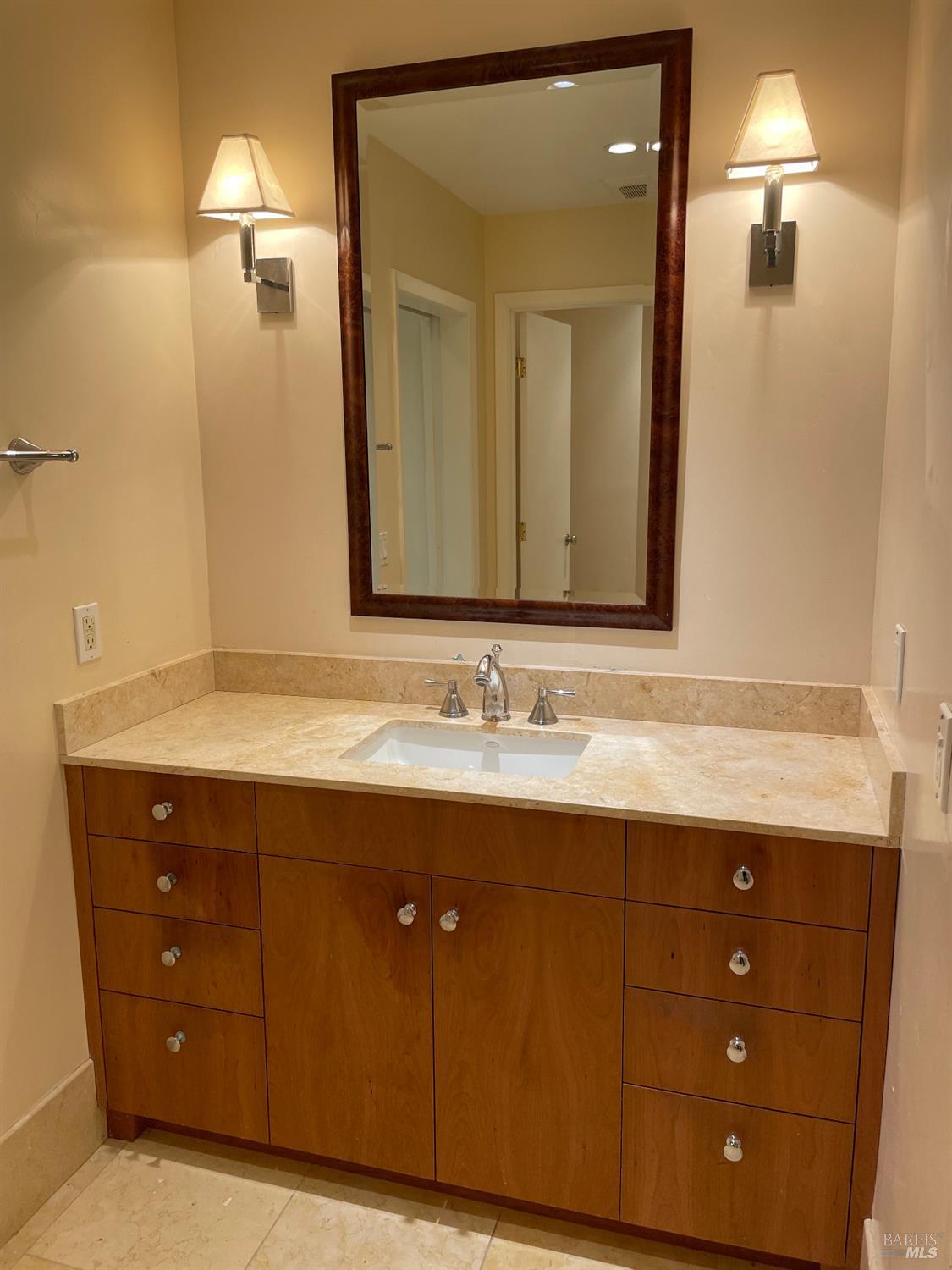 48 Marin Avenue Sausalito, CA 94965 - Photo 14 of 18 a bathroom with a granite countertop sink and a mirror
