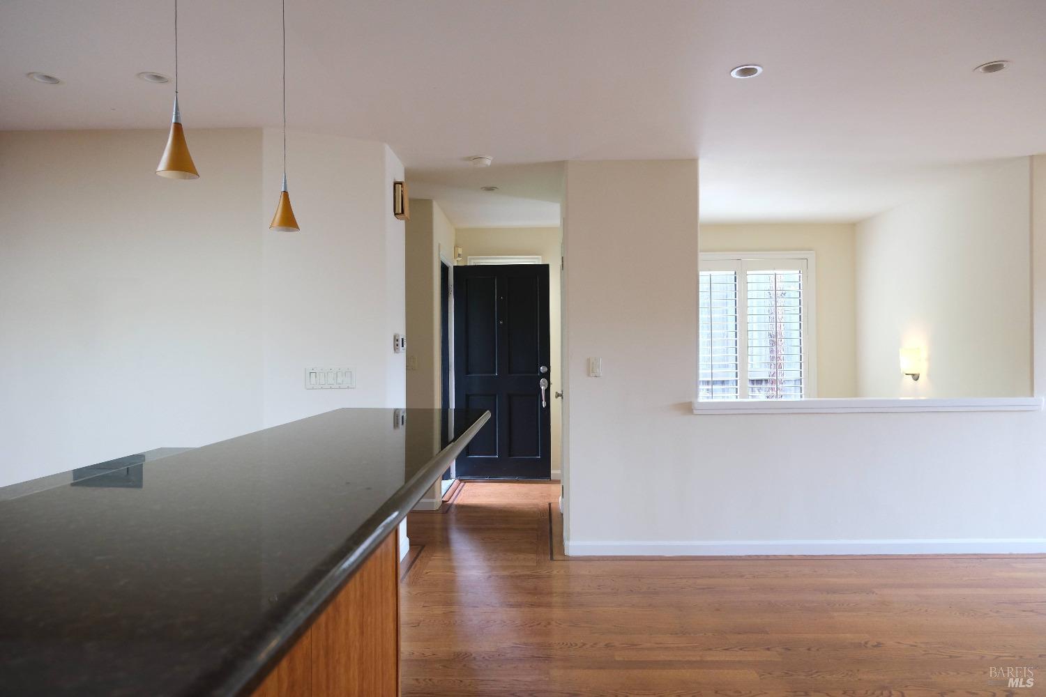 48 Marin Avenue Sausalito, CA 94965 - Photo 4 of 18 a view of a hallway with wooden floor and staircase
