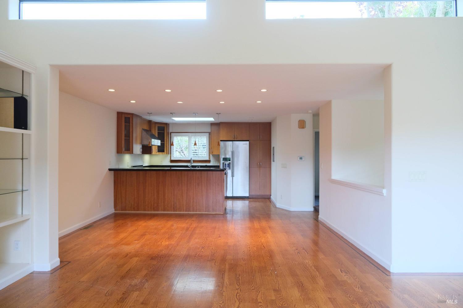 48 Marin Avenue Sausalito, CA 94965 - Photo 7 of 18 a view of kitchen with kitchen island stainless steel appliances refrigerator stove microwave and cabinets