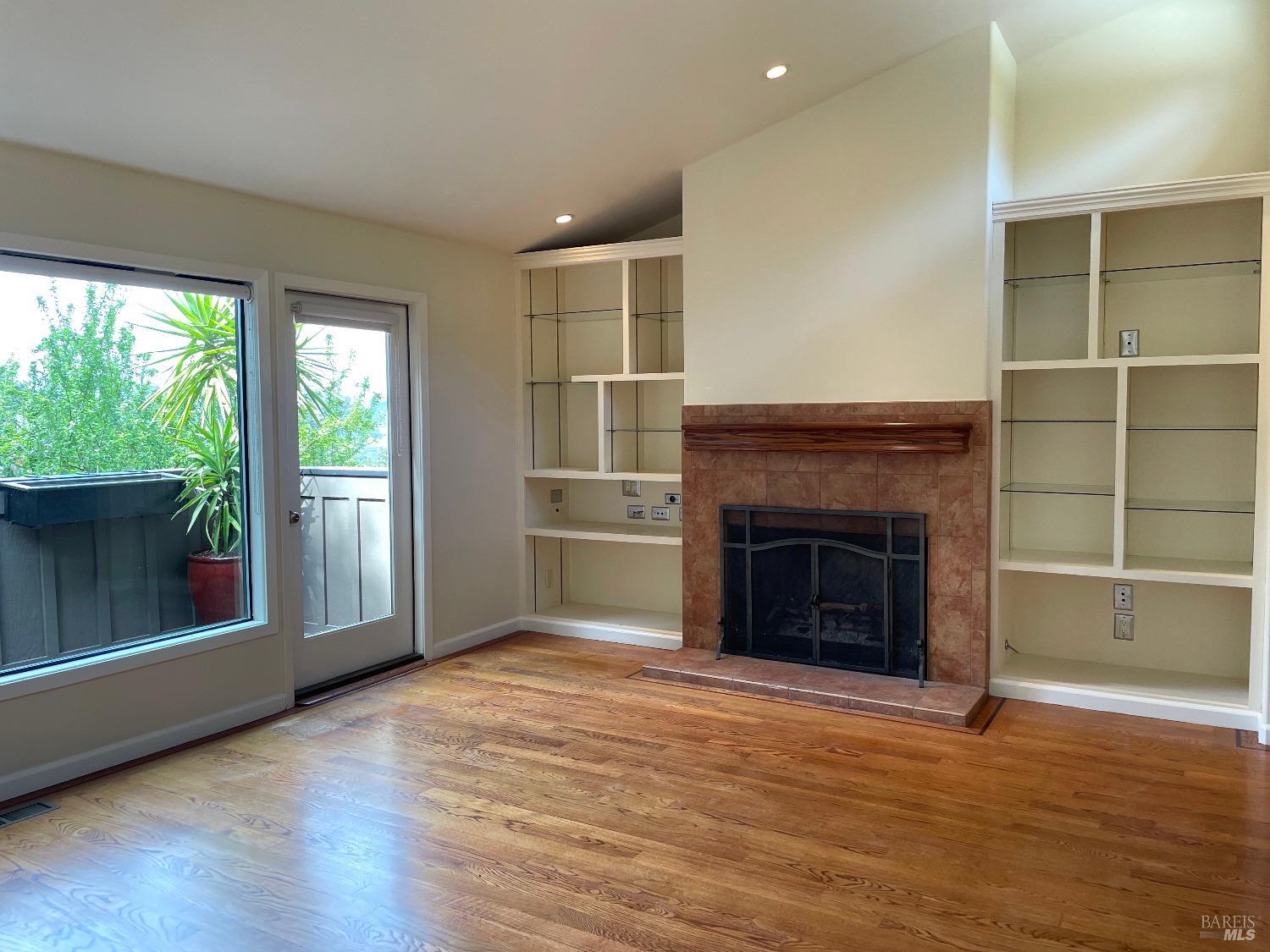 48 Marin Avenue Sausalito, CA 94965 - Photo 10 of 18 a view of a livingroom with a fireplace and window
