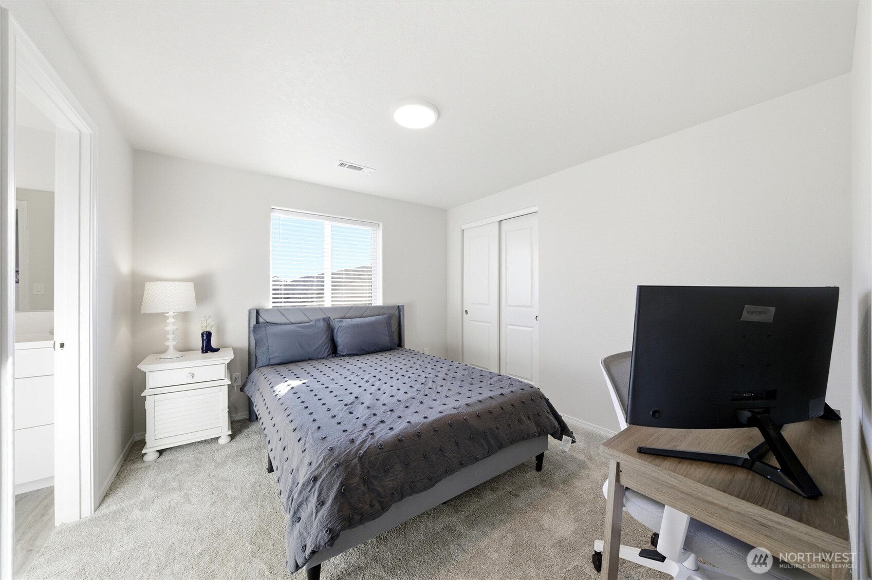 1106 Ava Street Walla Walla, WA 99362 - Photo 21 of 39 a bedroom with a bed and a flat screen tv