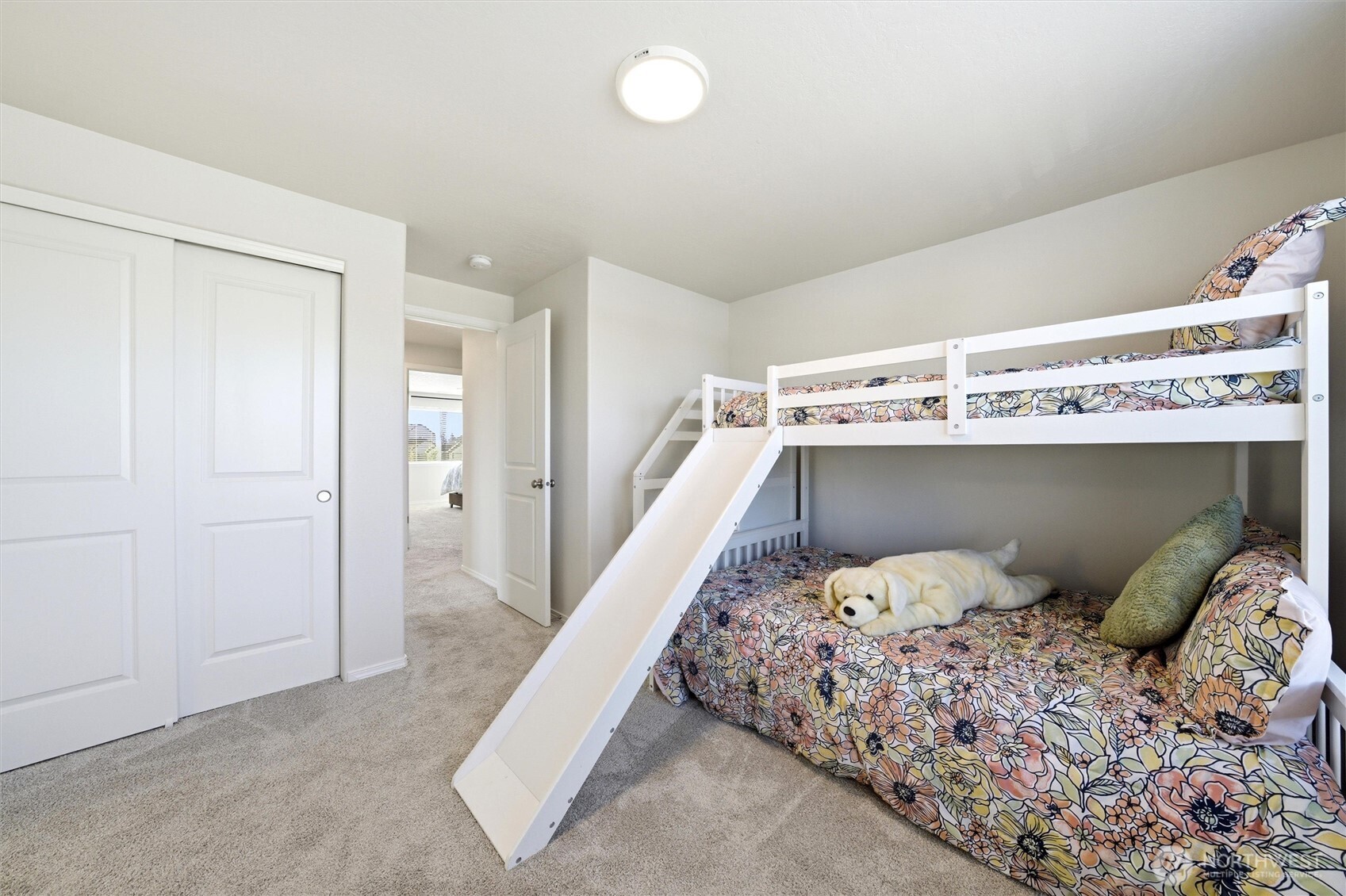 1106 Ava Street Walla Walla, WA 99362 - Photo 26 of 39 a bedroom with a bed and wooden floor