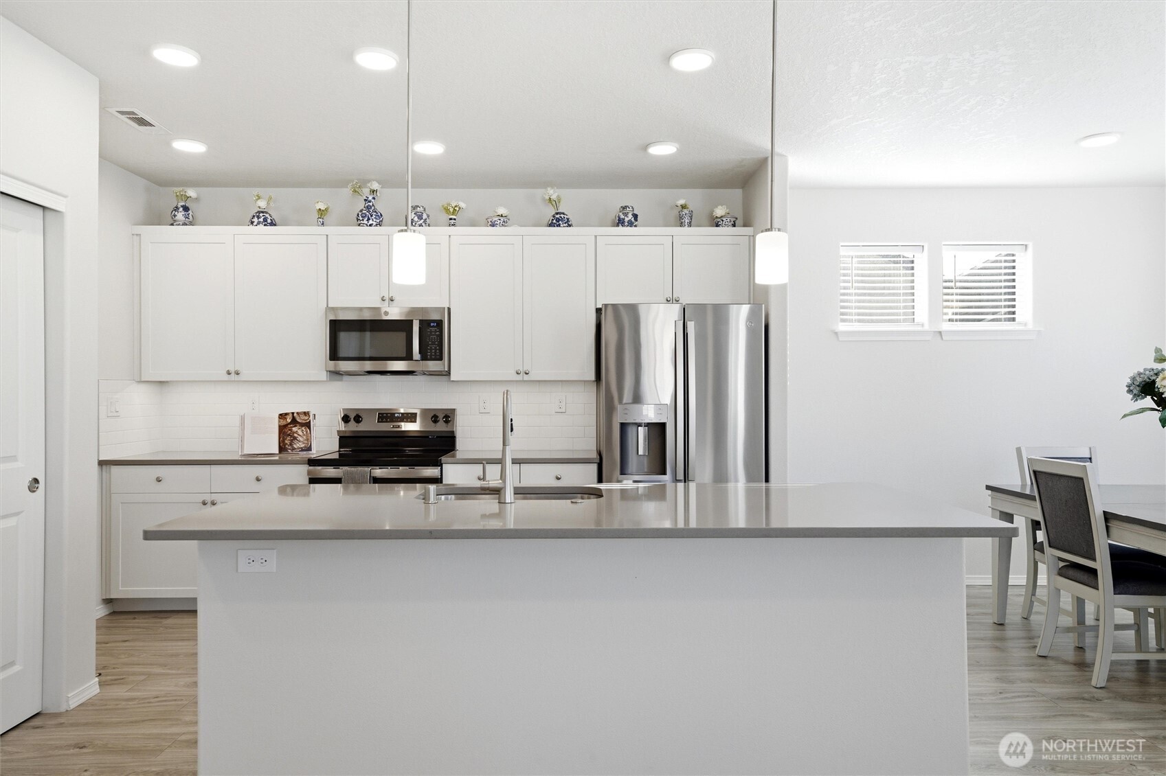 1106 Ava Street Walla Walla, WA 99362 - Photo 4 of 39 a kitchen with stainless steel appliances a refrigerator sink and microwave