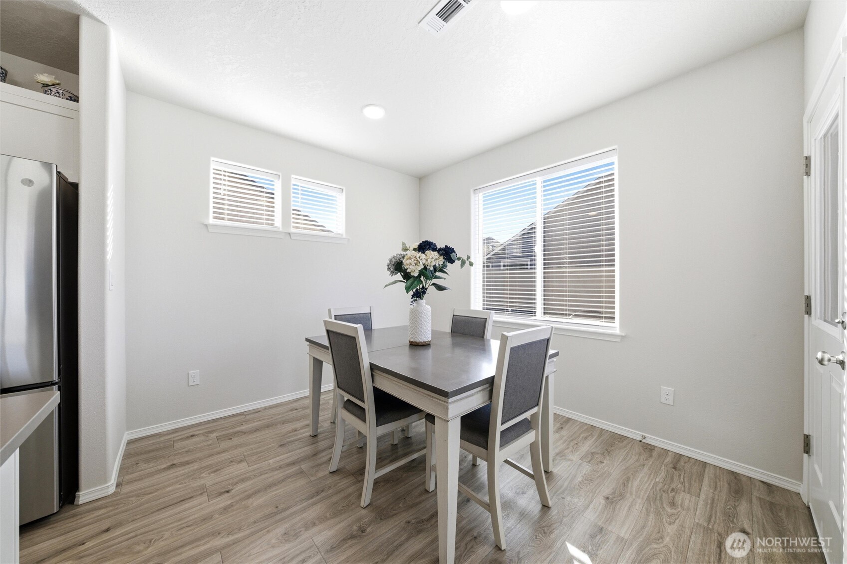 1106 Ava Street Walla Walla, WA 99362 - Photo 6 of 39 a view of a dining room with furniture window and wooden floor