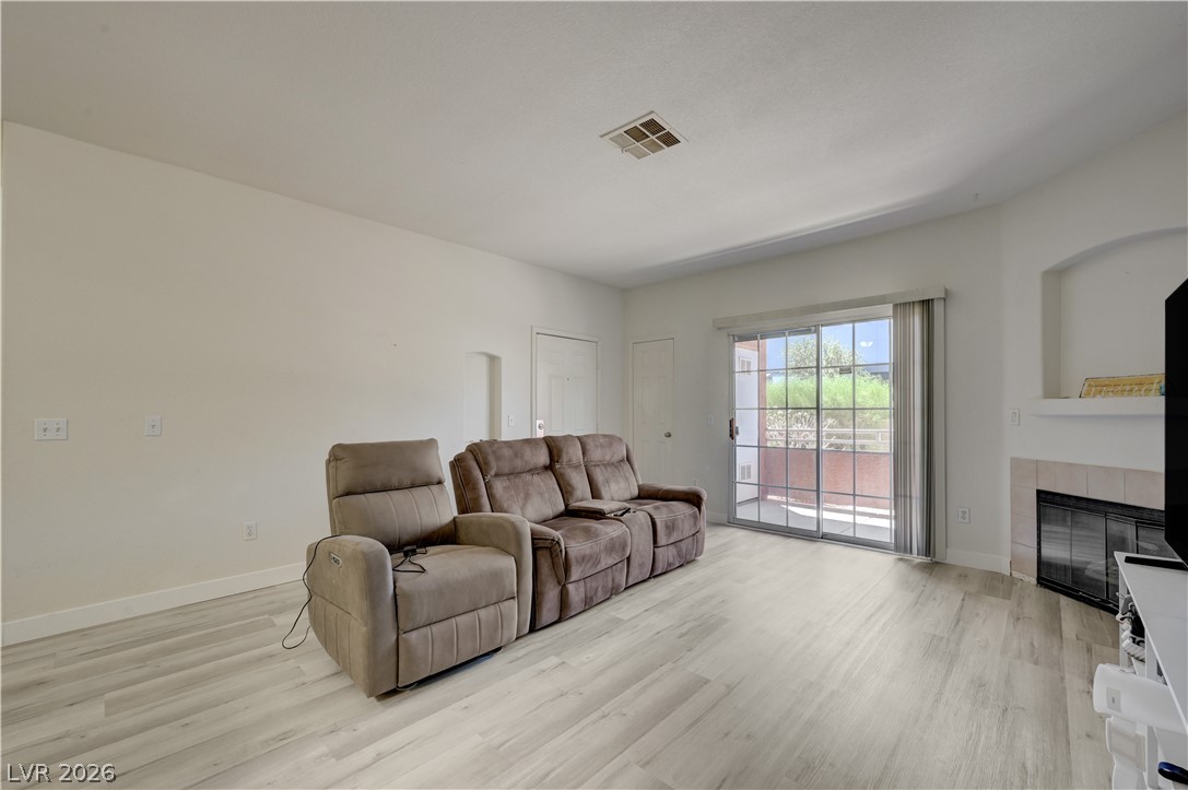 4730 East Craig Road, Unit 1155 Las Vegas, NV 89115 - Photo 6 of 41 A well-lit living area offers contemporary flooring and direct access to a private outdoor space.