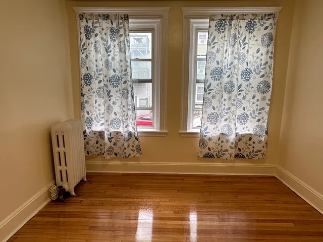 a view of door with wooden floor