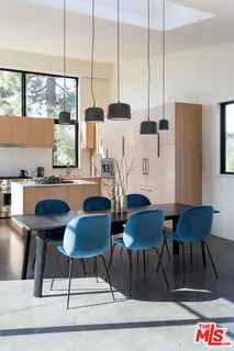 a view of a dining room with furniture and window