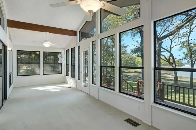 a view of an empty room with windows