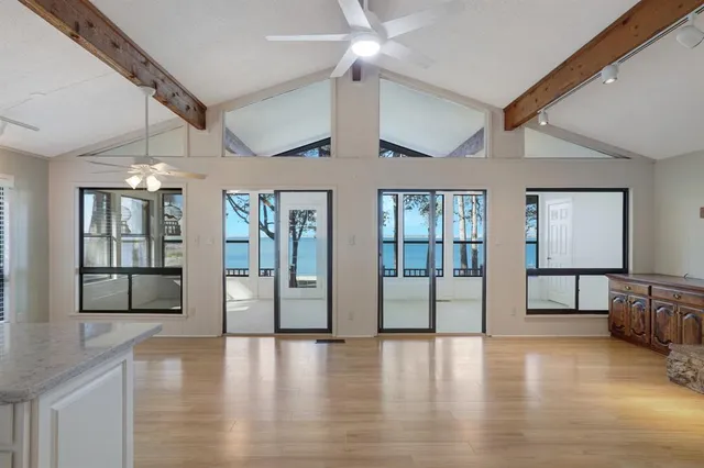 a view of an entryway with wooden floor