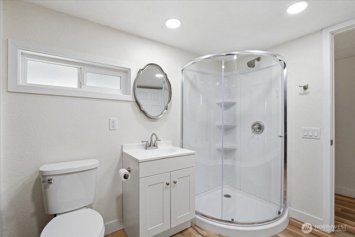 293 Barkley Road Manson, WA 98831 - Photo 23 of 40 a bathroom with a toilet a sink and mirror