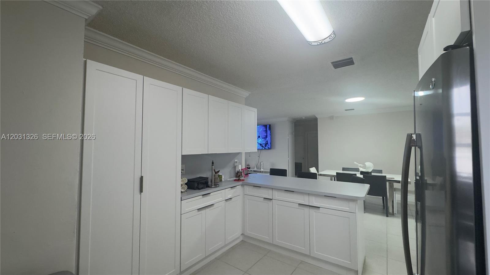12480 Southwest 189th Street Miami, FL 33177 - Photo 5 of 25 a kitchen with cabinets and window