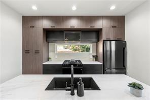 1030 Coleman Street Southwest Atlanta, GA 30310 - Photo 17 of 42 a kitchen with a sink and a refrigerator