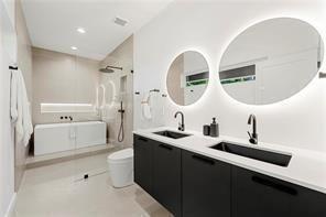 1030 Coleman Street Southwest Atlanta, GA 30310 - Photo 26 of 42 a bathroom with a double vanity sink mirror and bathtub
