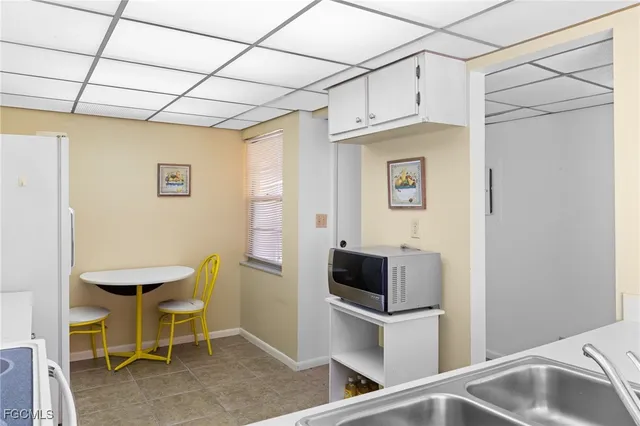 a kitchen with table and chairs