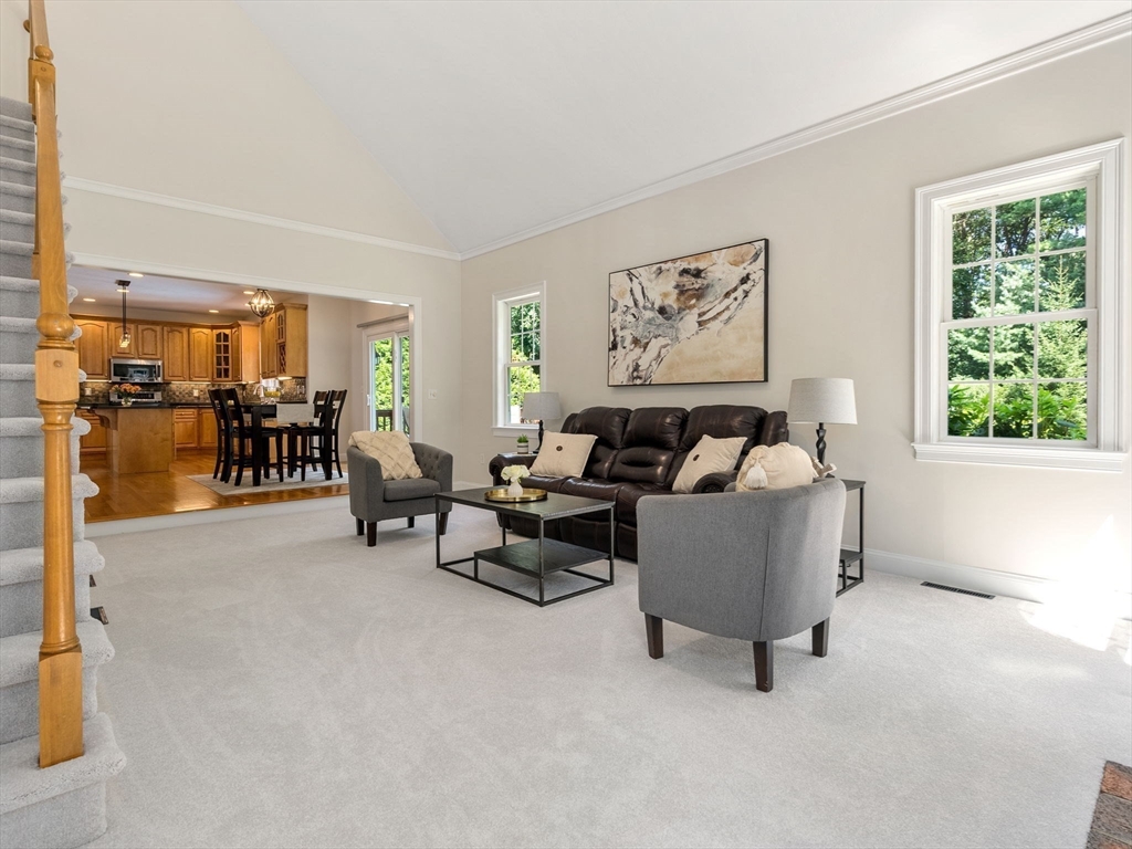 13 Breakneck Hill Road, Unit 1 Hopkinton, MA 01748 - Photo 17 of 37 a living room with furniture and a window