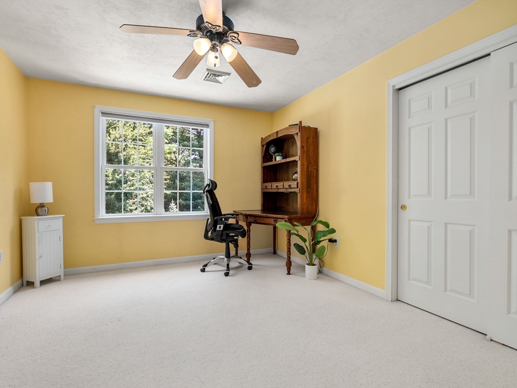 13 Breakneck Hill Road, Unit 1 Hopkinton, MA 01748 - Photo 31 of 37 an empty room with windows and fan