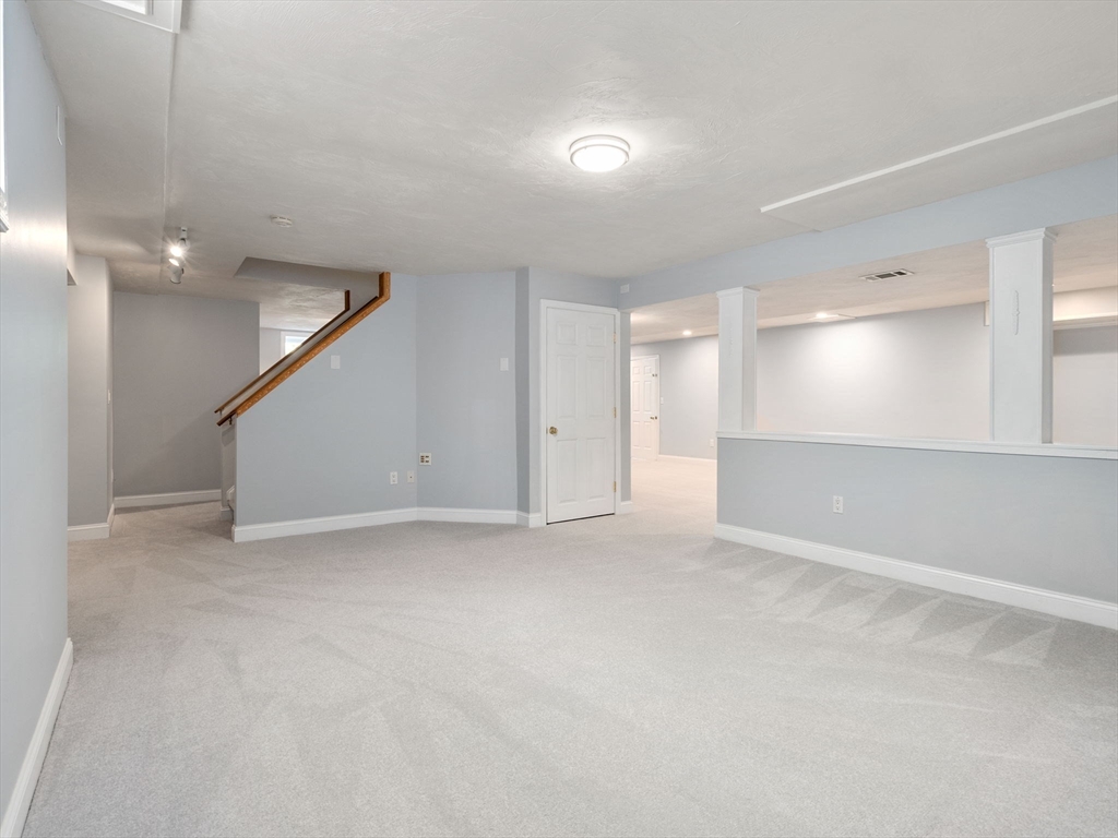 13 Breakneck Hill Road, Unit 1 Hopkinton, MA 01748 - Photo 37 of 37 an empty room with a empty space and windows