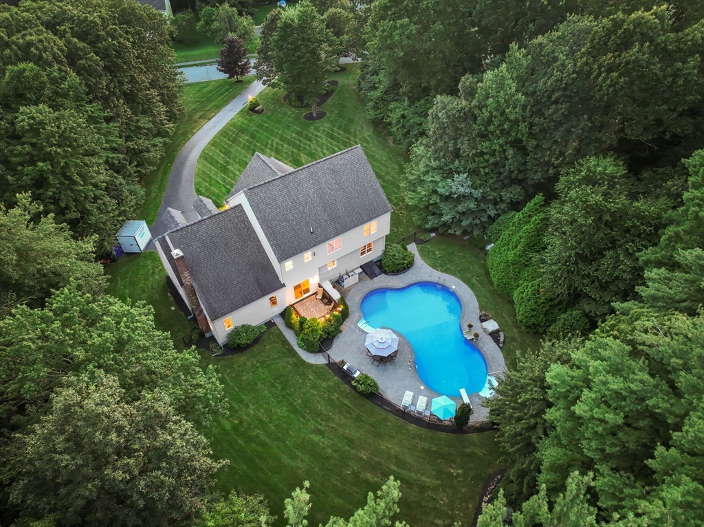 13 Breakneck Hill Road, Unit 1 Hopkinton, MA 01748 - Photo 4 of 37 an aerial view of a house with a swimming pool a yard and a garden