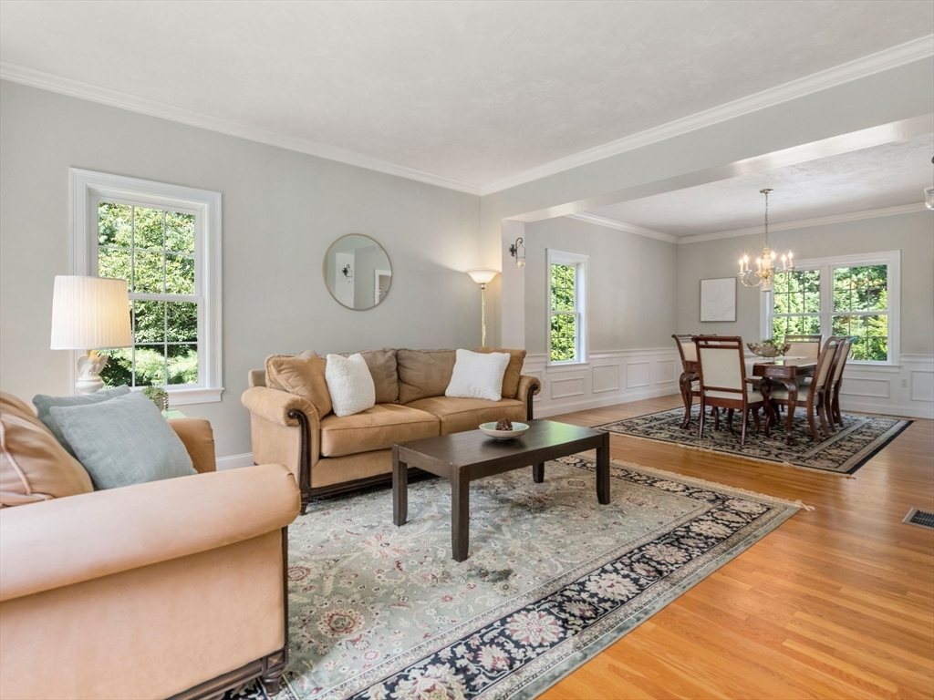 13 Breakneck Hill Road, Unit 1 Hopkinton, MA 01748 - Photo 9 of 37 a living room with furniture and wooden floor