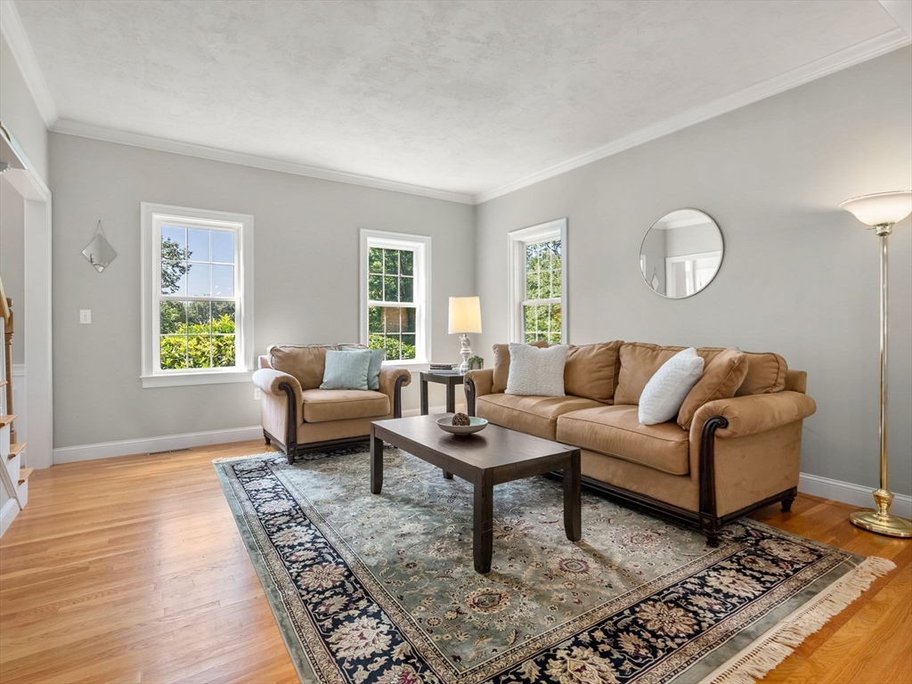 13 Breakneck Hill Road, Unit 1 Hopkinton, MA 01748 - Photo 10 of 37 a living room with furniture and a rug