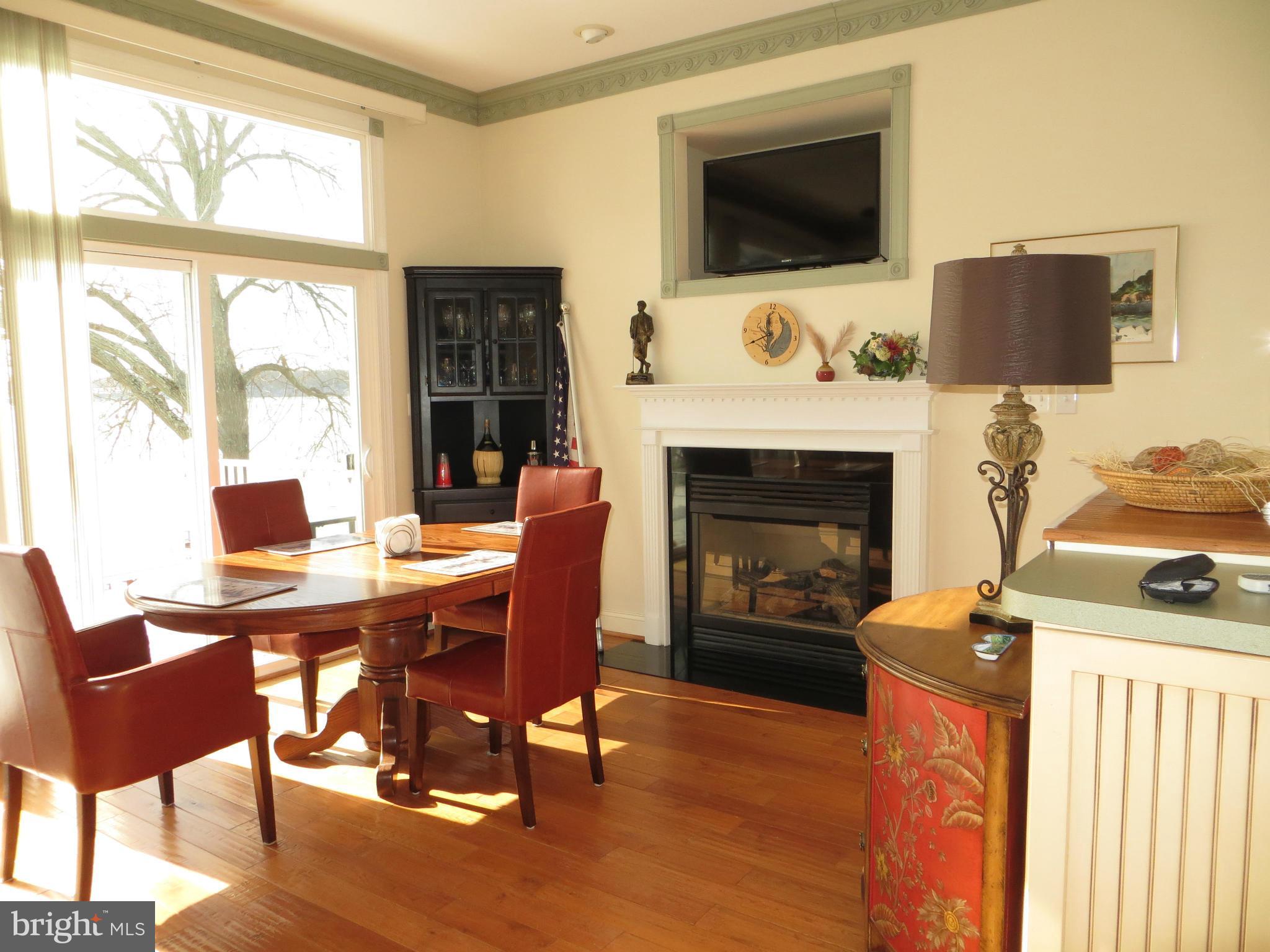 LIVING-DINING AREA HAS FIREPLACE