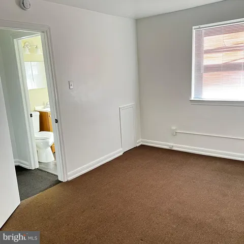 a view of a room that has a window in it