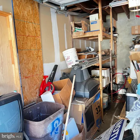 a living room with furniture and a book shelf