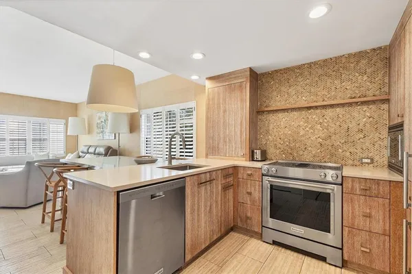 a kitchen with a sink a washer and dryer