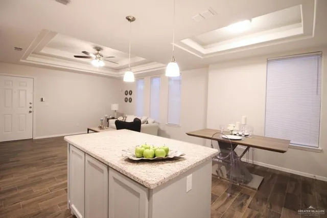 a room with a sink and a chandelier