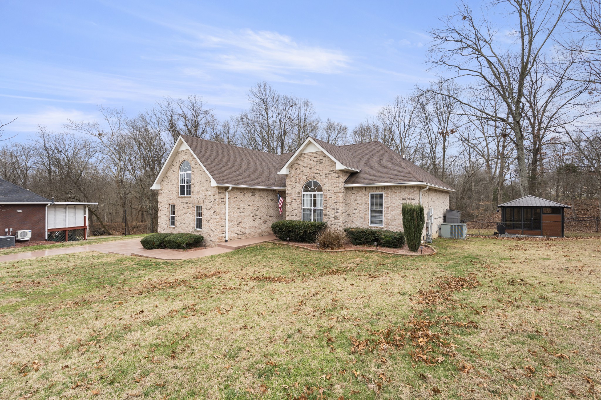 5037 Summit Drive Greenbrier, TN 37073 - Photo 2 of 53 a front view of a house with a yard and garage