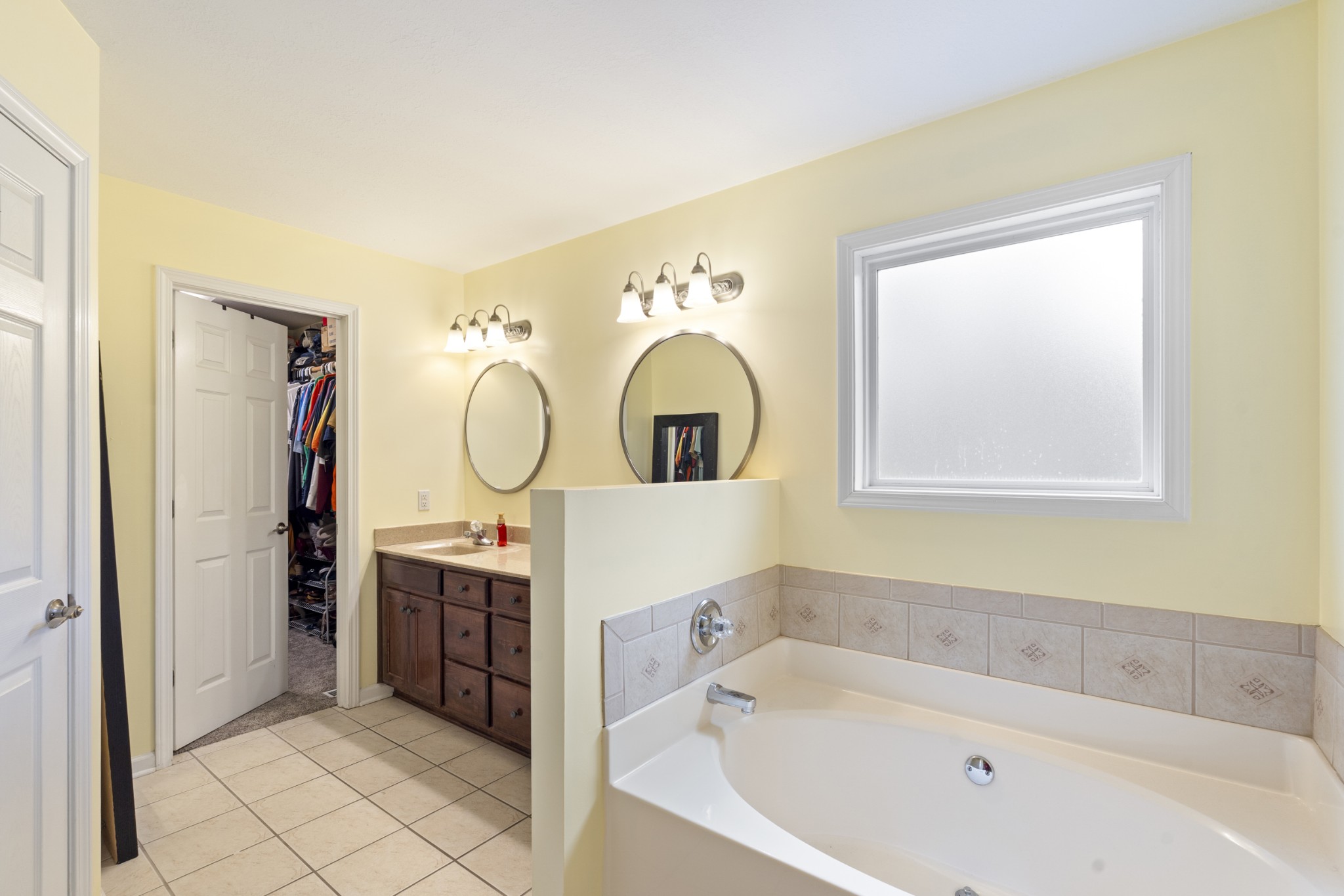 5037 Summit Drive Greenbrier, TN 37073 - Photo 35 of 53 a bathroom with a sink mirror and a bathtub