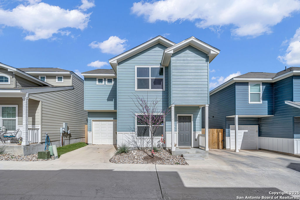 2045 Silver Oaks, Unit 18B San Antonio, TX 78213 - Photo 1 of 20 a front view of a house with garden and parking