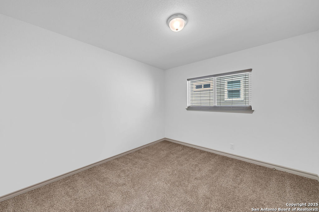 2045 Silver Oaks, Unit 18B San Antonio, TX 78213 - Photo 15 of 20 an empty room with a window