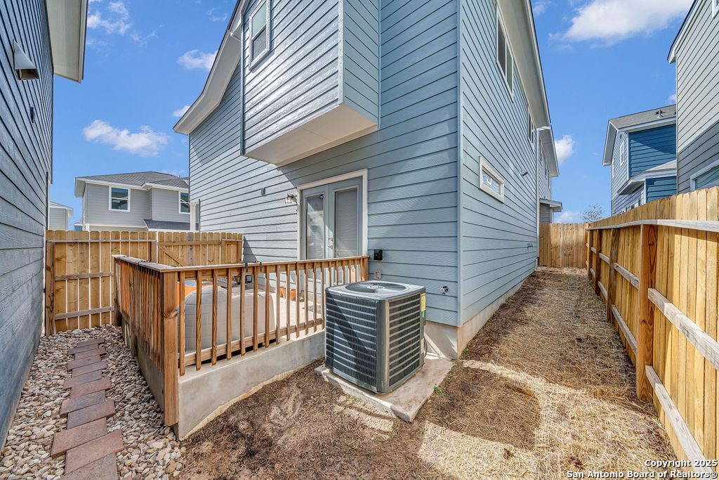 2045 Silver Oaks, Unit 18B San Antonio, TX 78213 - Photo 19 of 20 a view of a house with wooden fence