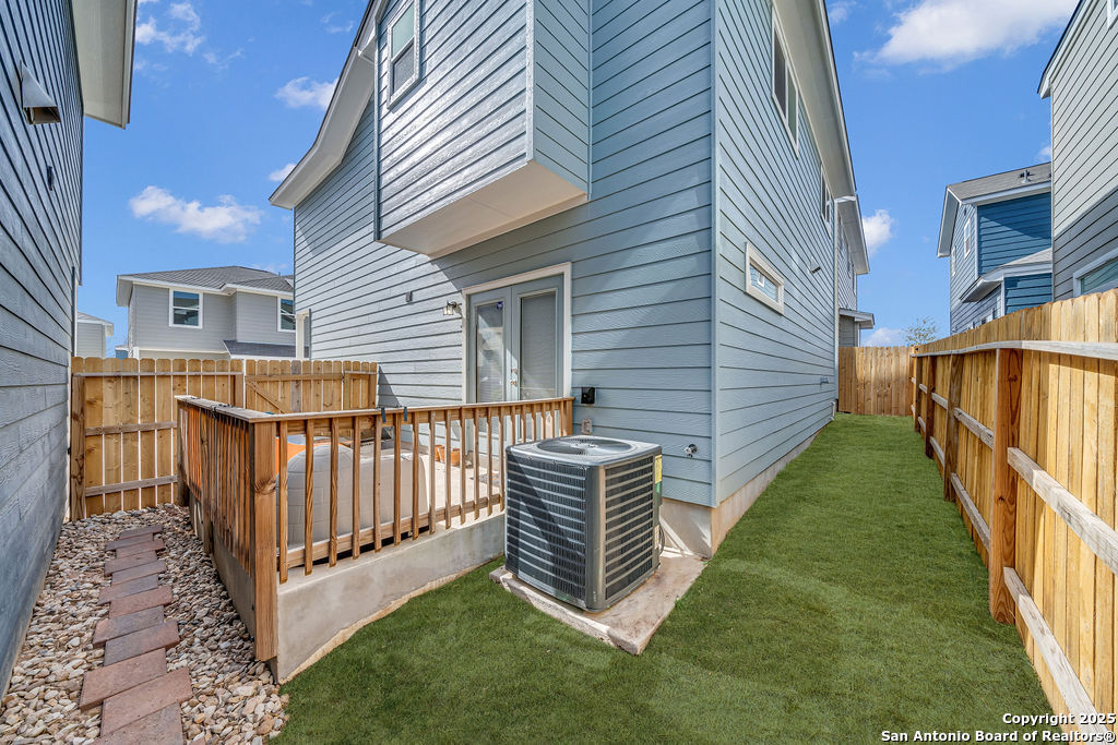 2045 Silver Oaks, Unit 18B San Antonio, TX 78213 - Photo 20 of 20 a view of a house with backyard and porch with wooden fence