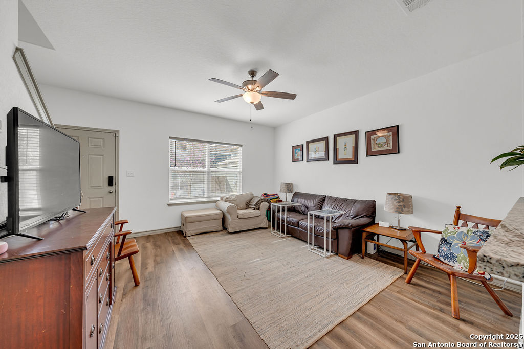 2045 Silver Oaks, Unit 18B San Antonio, TX 78213 - Photo 4 of 20 a living room with furniture and wooden floor