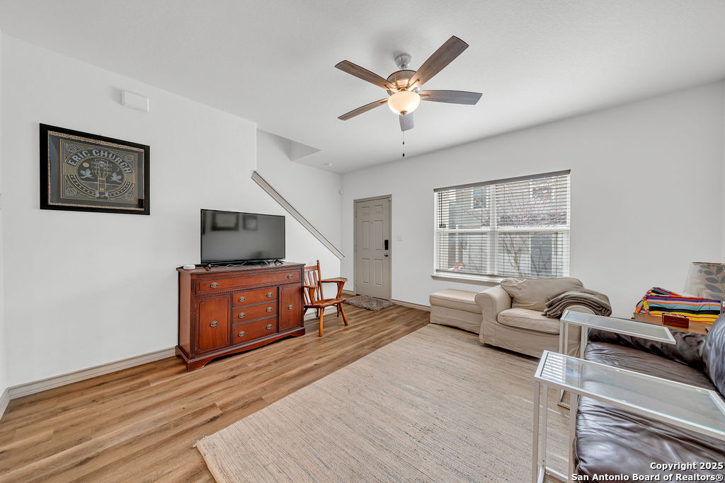 2045 Silver Oaks, Unit 18B San Antonio, TX 78213 - Photo 5 of 20 a living room with furniture and a flat screen tv